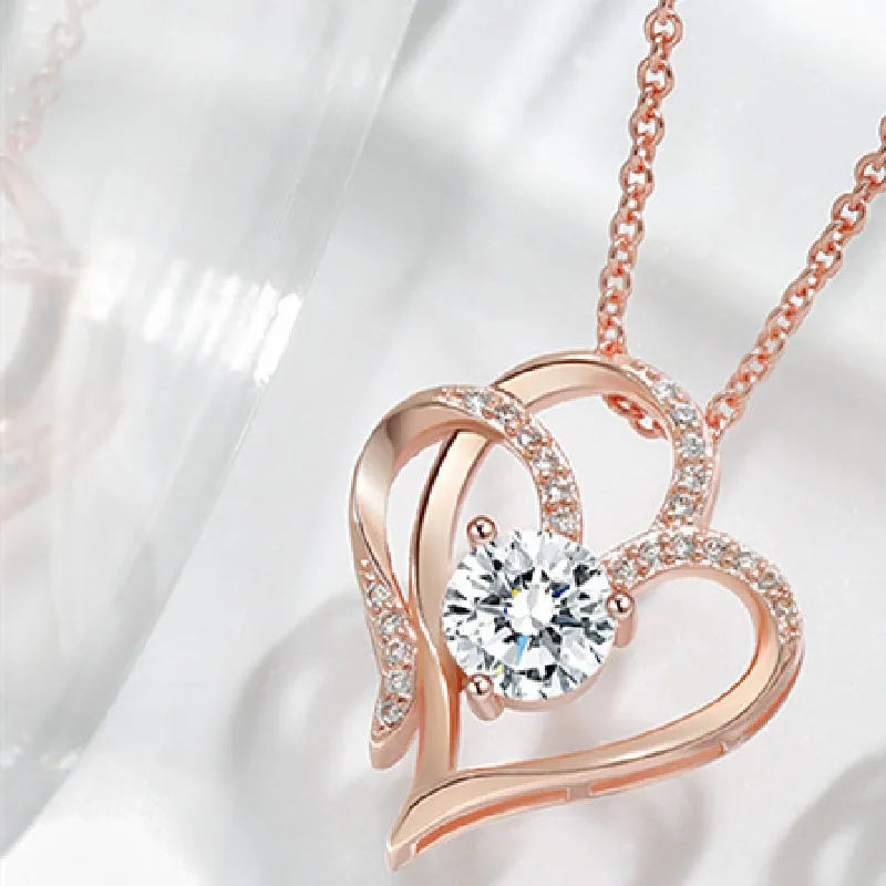 Women's heart-shaped pendant necklace in 925 silver with choice of platinum, gold, or rose gold finish.