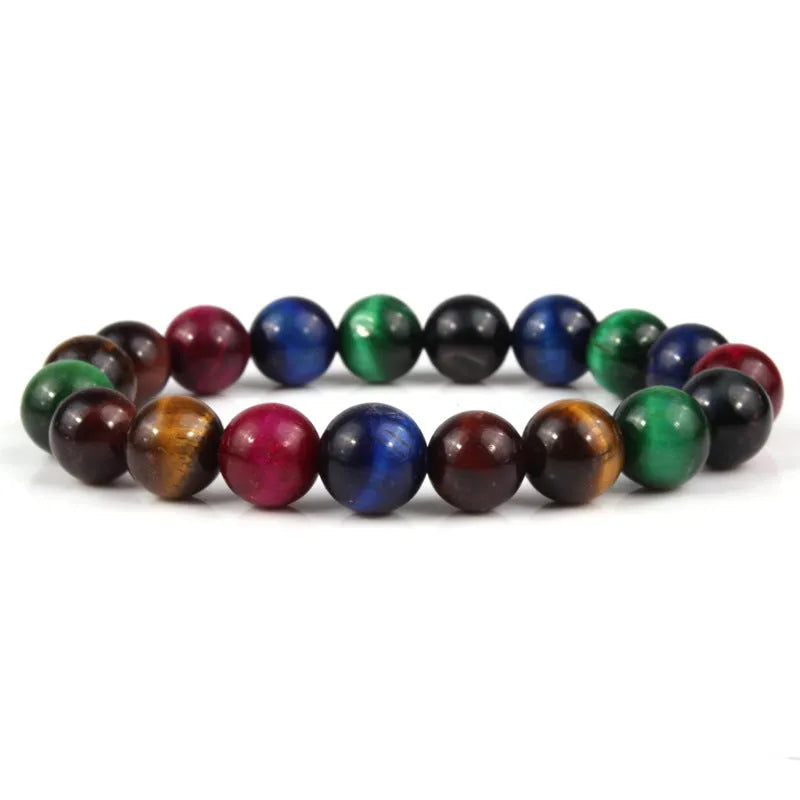 Tiger eye crystal stone bracelet showing round beads available in multiple colours and sizes on a wrist.