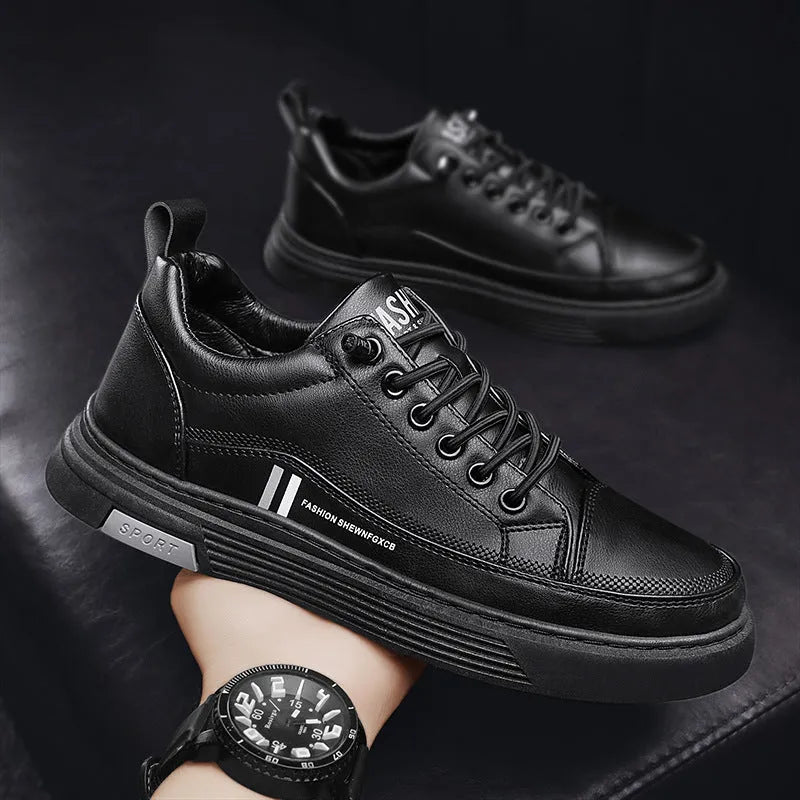 Men's white and black low-top skate shoes with an elastic band and round toe on a rubber sole.