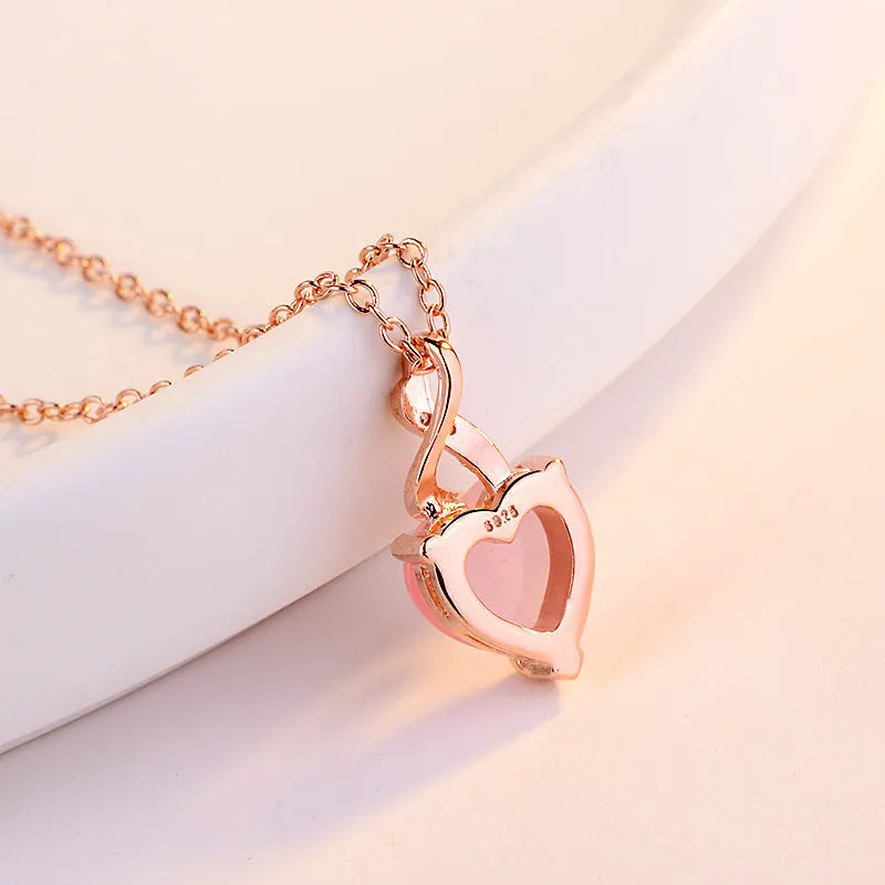 Women's heart-shaped artificial crystal pendant on rose gold electroplated cross chain necklace