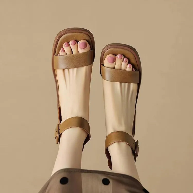 White women's retro platform high heels with an ankle strap and round toe.