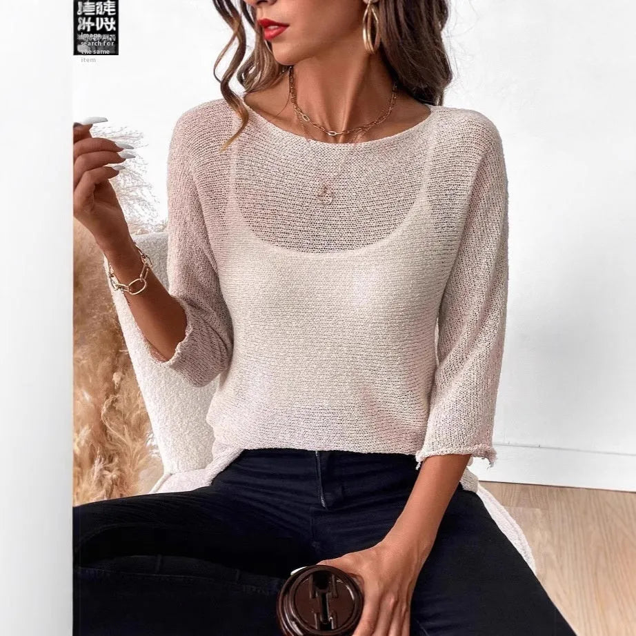 Women's off-shoulder knitted pullover top in lavender purple with a 3D pattern and 3/4 length sleeves.