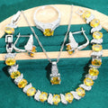Four-piece bridal jewellery set showing necklace, earrings, ring, and bracelet with zircon alloy pendants