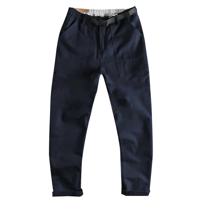 Men's khaki and dark blue cotton casual trousers with a mid-waist fit and zip fly.