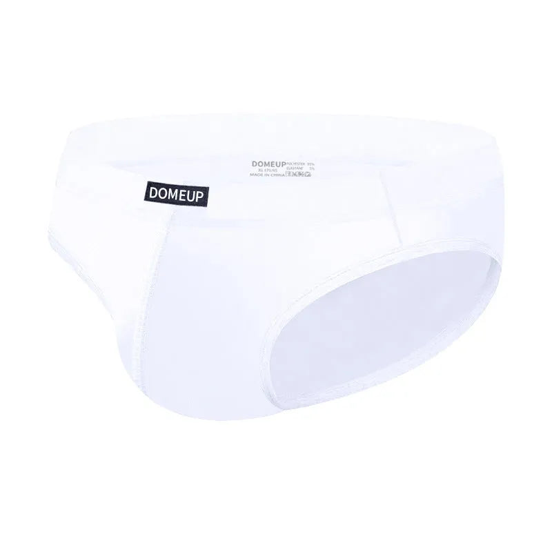 Men's solid colour low-waist briefs in black, shown flat, highlighting seamless construction.