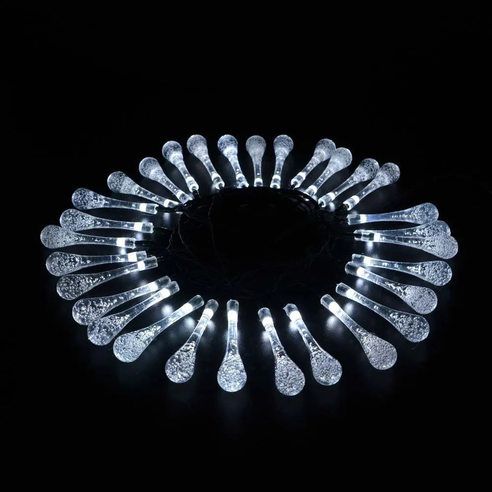 Solar-powered LED Water Drops string lights with ABS plastic pendants on a 6.5 metre wire for outdoor gardens.