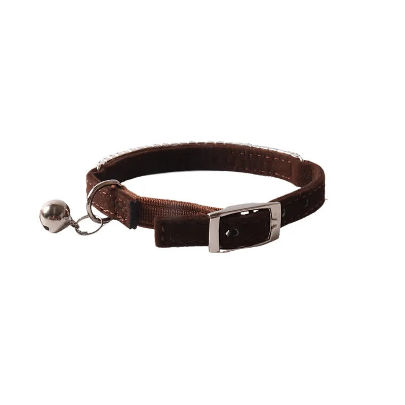 Colourful flocked cat collar with elastic buckle in pink, black, red, blue, purple, and dark brown options.