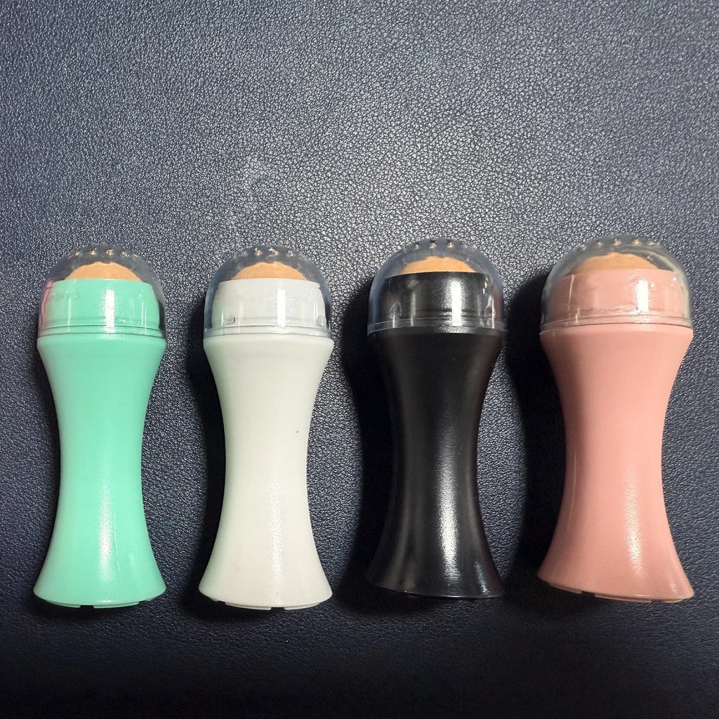 Volcanic stone facial roller for oil control in black, green, pink and white colour options.
