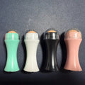Volcanic stone facial roller for oil control in black, green, pink and white colour options.