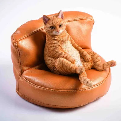 Lazy cat car ornament figure with sofa accessory on dashboard