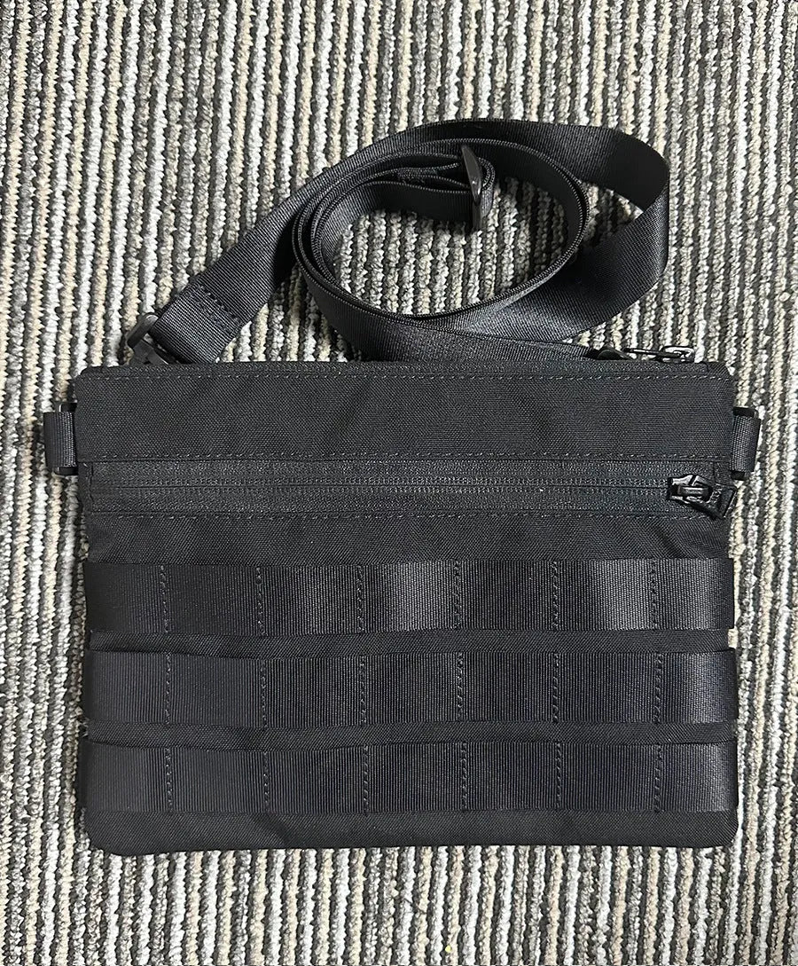 Black solid colour oxford cloth portable outdoor organiser bag with 18cm by 3.5cm dimensions.