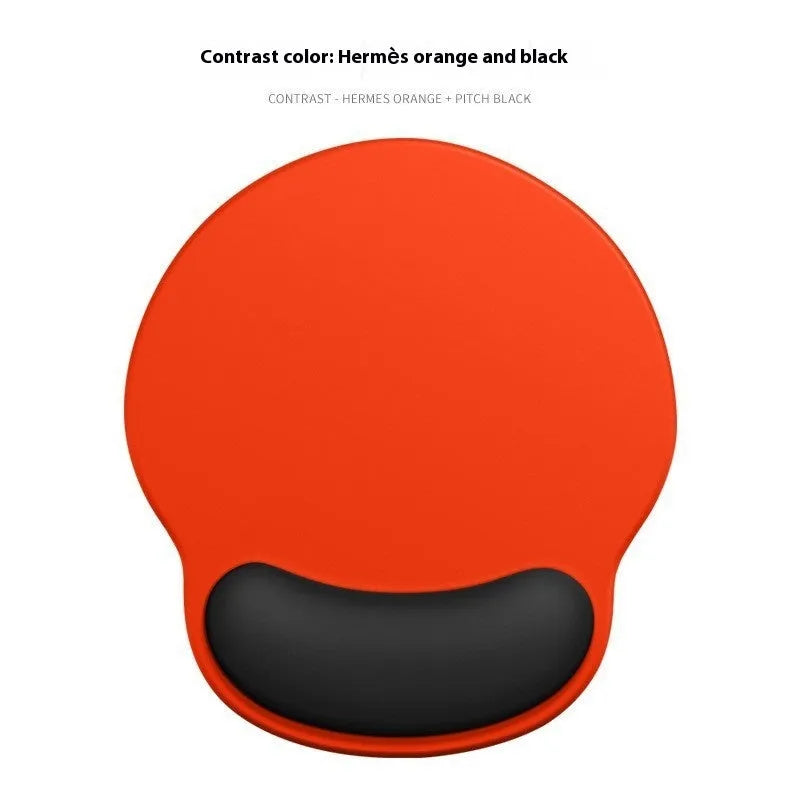 Silicone mouse mat with wrist rest in gradient colour pattern on desk