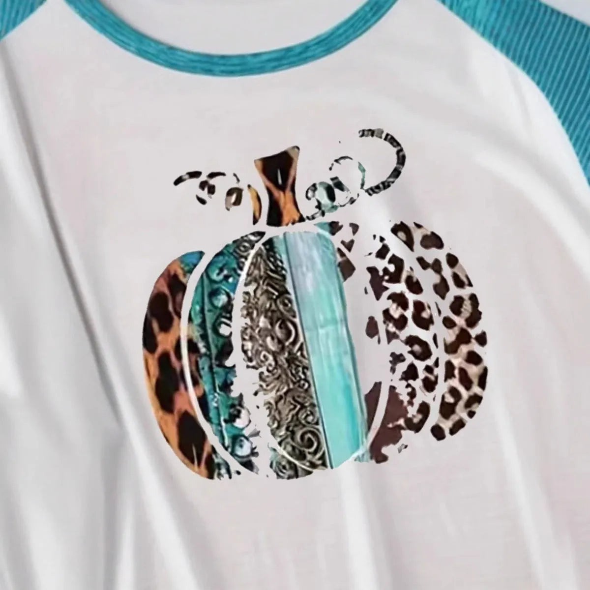 Sky blue long sleeve t-shirt with a large 3D digital printed Halloween pumpkin design on the front.