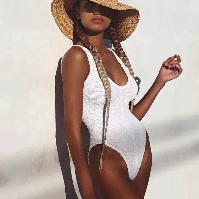 Women's backless one-piece swimsuit in wrinkled seersucker bubble cloth fabric, shown in a solid colour.