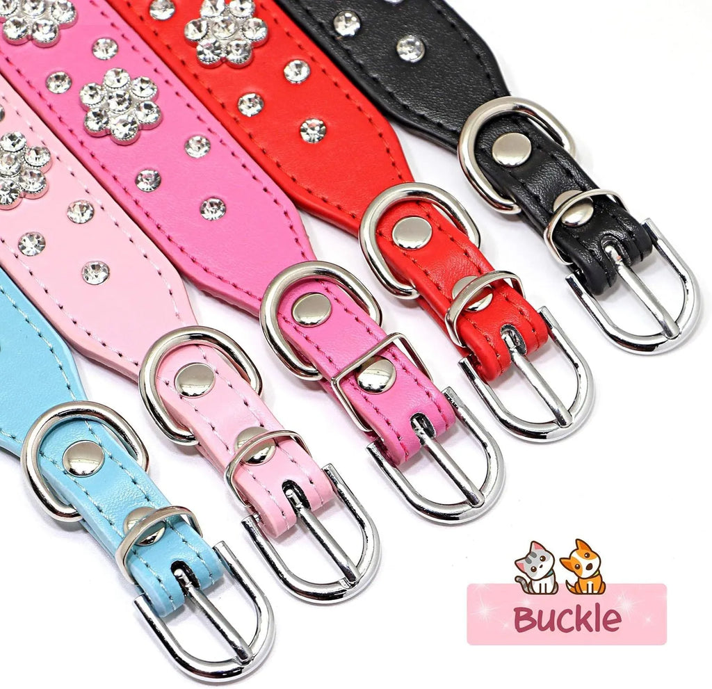 Close-up of a pink PU leather dog collar with silver rhinestone flowers and studs, showing the metal D-ring.