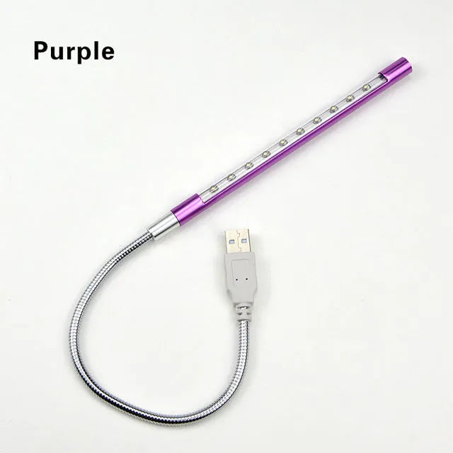 Spiral-shaped USB LED night light in metallic finish with aluminium alloy shade and metal base.