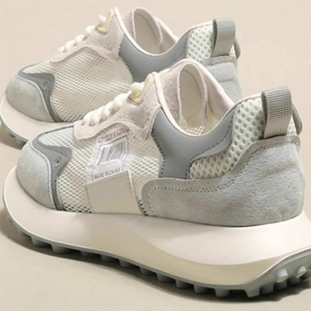 Women's grey and pink retro low-top sneaker with round toe and rubber sole