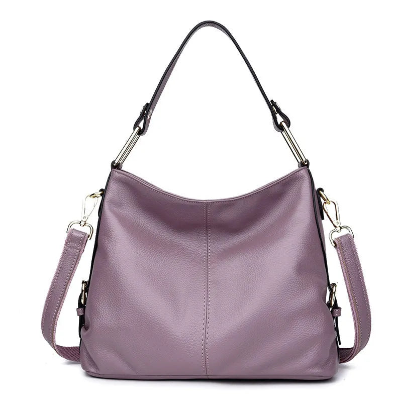 Genuine leather vertical square crossbody bag showing internal zipper compartments and external sandwich pocket
