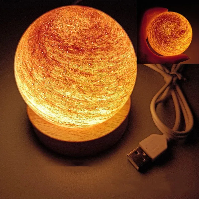 Planets themed USB night light with modern design and three-colour dimming on bedside table.