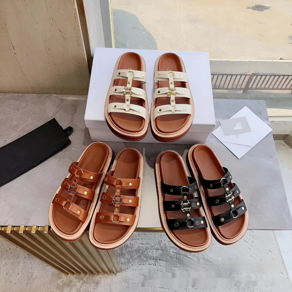 Women's brown patent leather Roman sandal slippers with sheepskin upper on a white background.