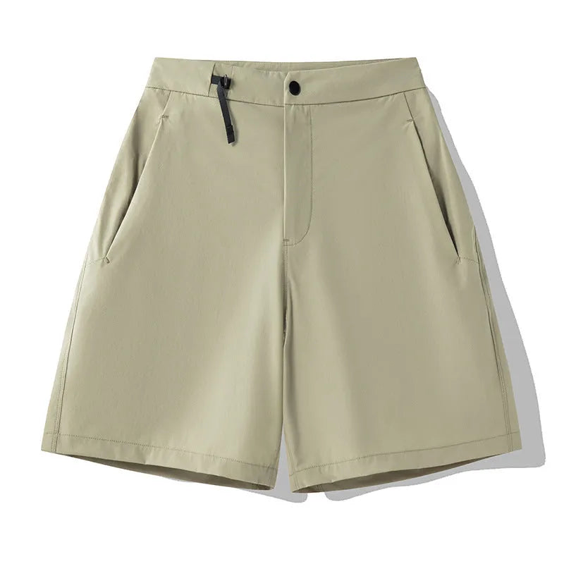 Men's khaki quick-drying sports shorts with 3D elastic cutting on a grey background.