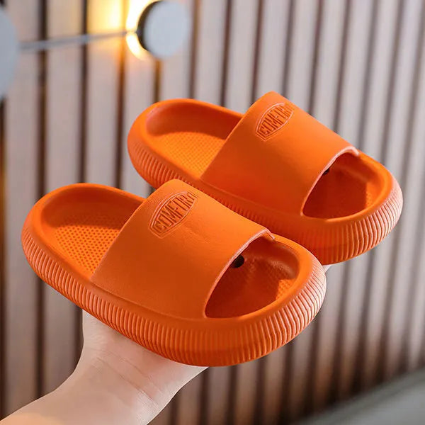 Children's brightly coloured EVA slippers with a thick, non-slip sole.
