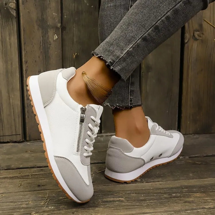 Women's flat-heeled casual shoes in champagne, grey, and white colours with artificial PU upper.