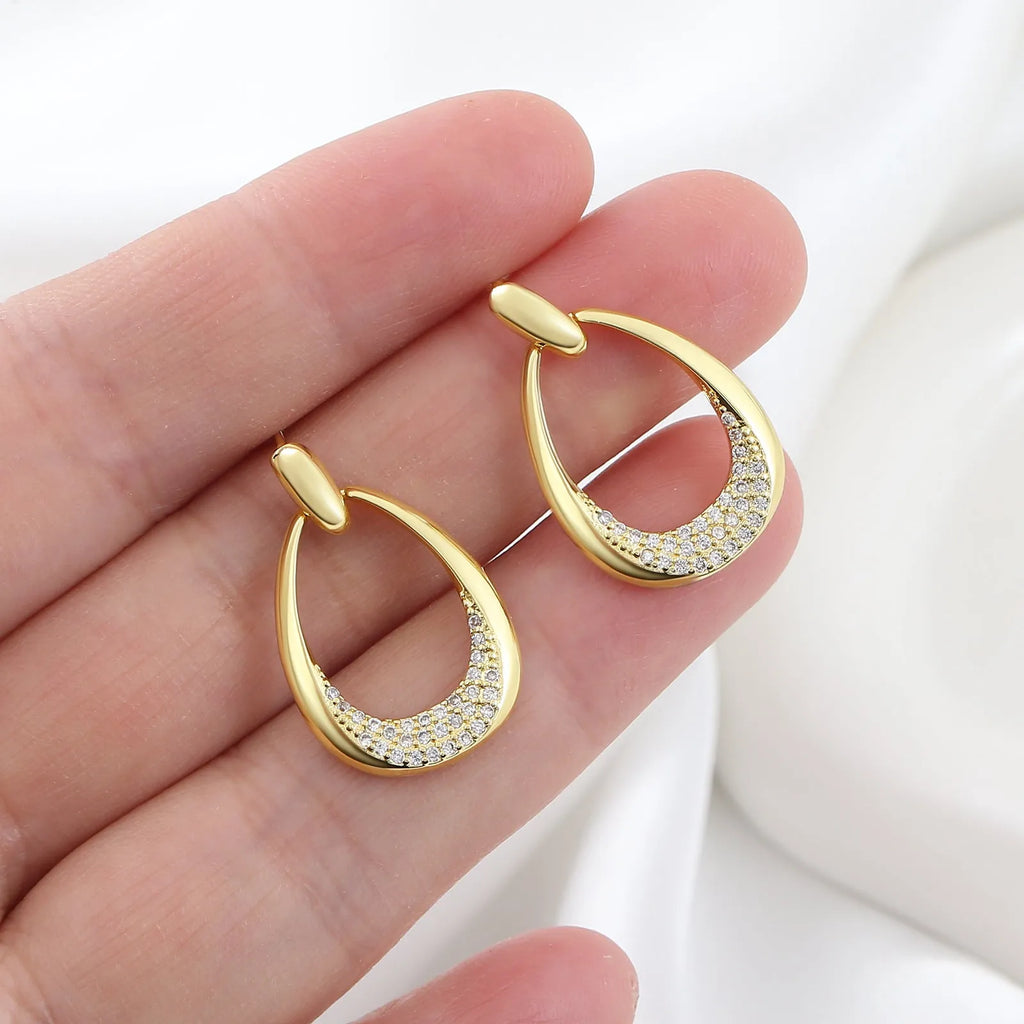 Women's yellow gold geometric drop earrings with copper electroplated finish measuring 2.6cm by 1.7cm