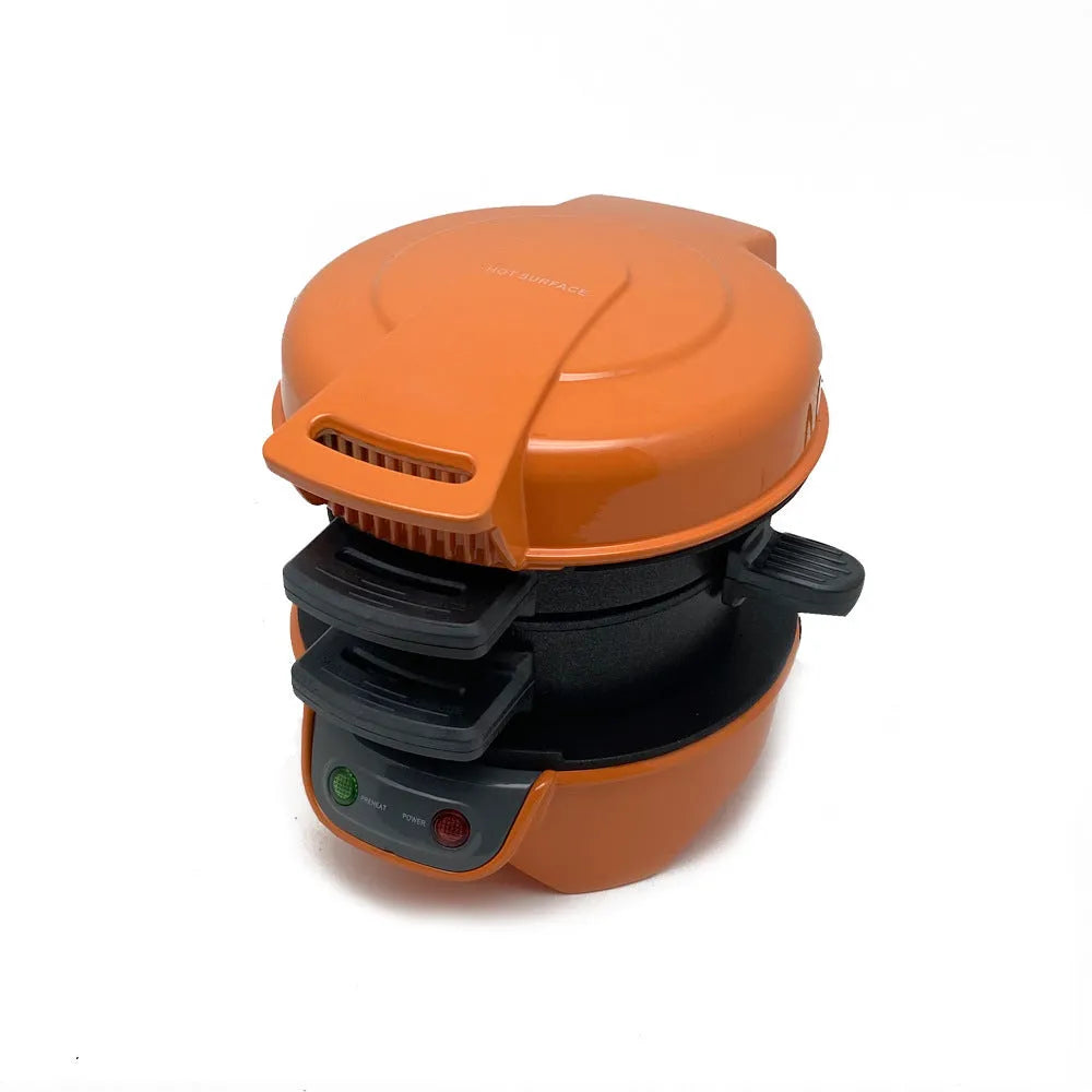 Bright red breakfast sandwich maker with egg cooker ring and two non-stick baking trays