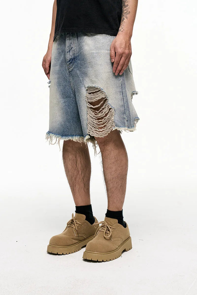 Light blue retro washed men's baggy denim shorts on a mid-waist model