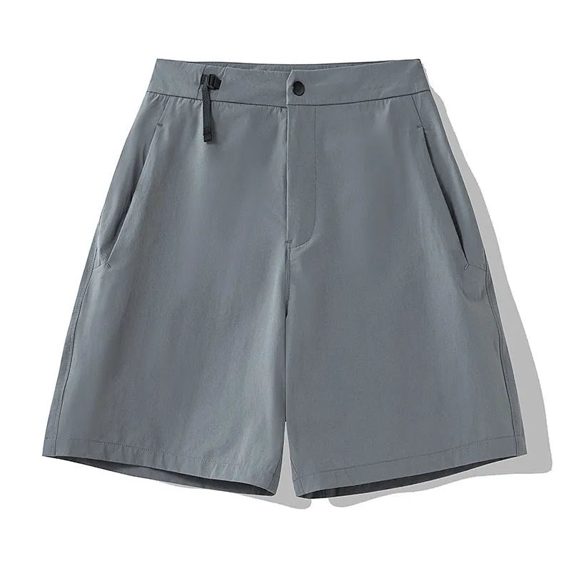 Men's khaki quick-drying sports shorts with 3D elastic cutting on a grey background.