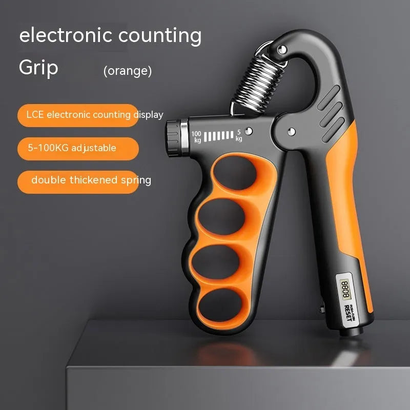 Orange electronic counter spring grip for hand strength training on a grey background.