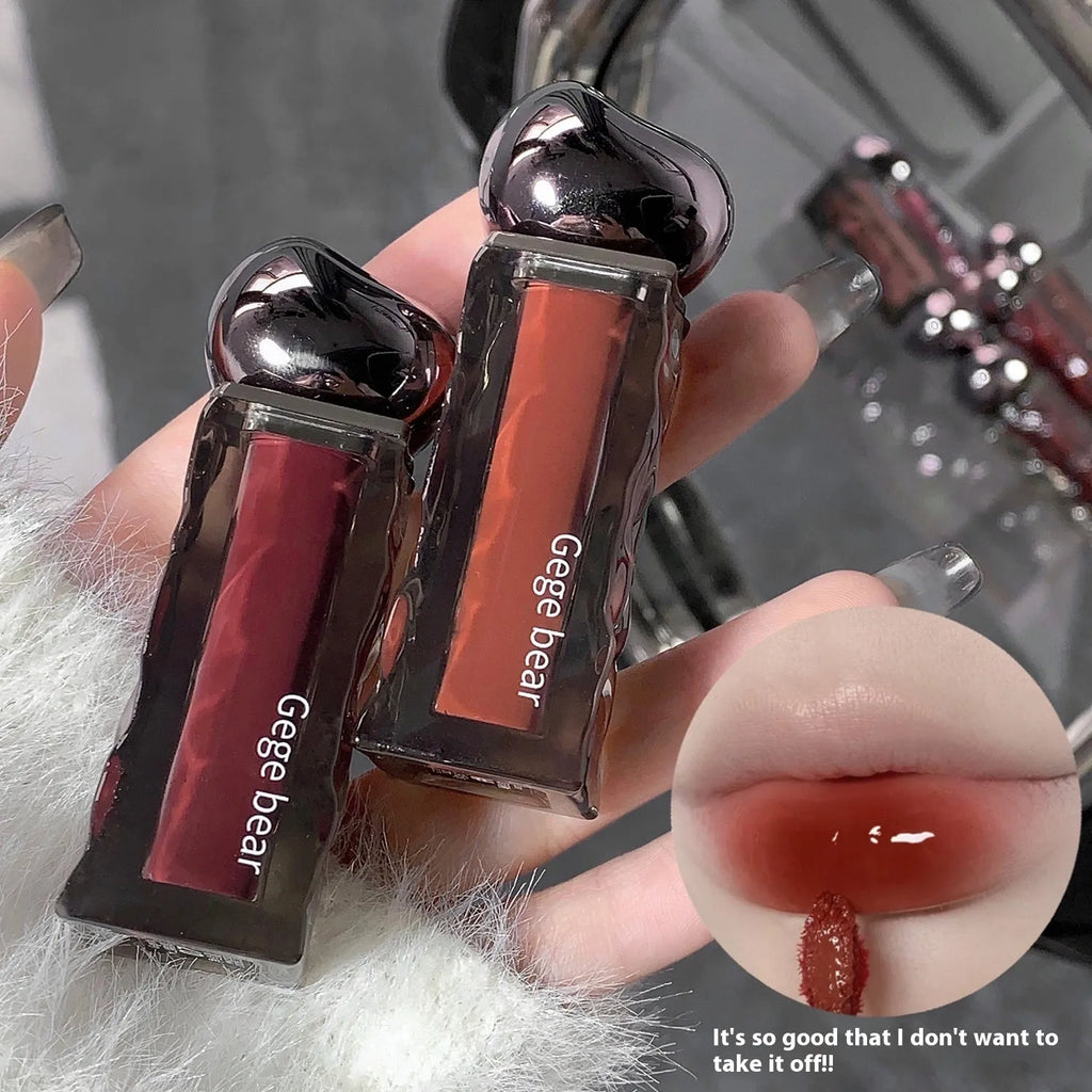 Glacier Lava Lip Lacquer lip gloss tube showcasing a high-shine, mirror finish, with visual of seven colour shade options.