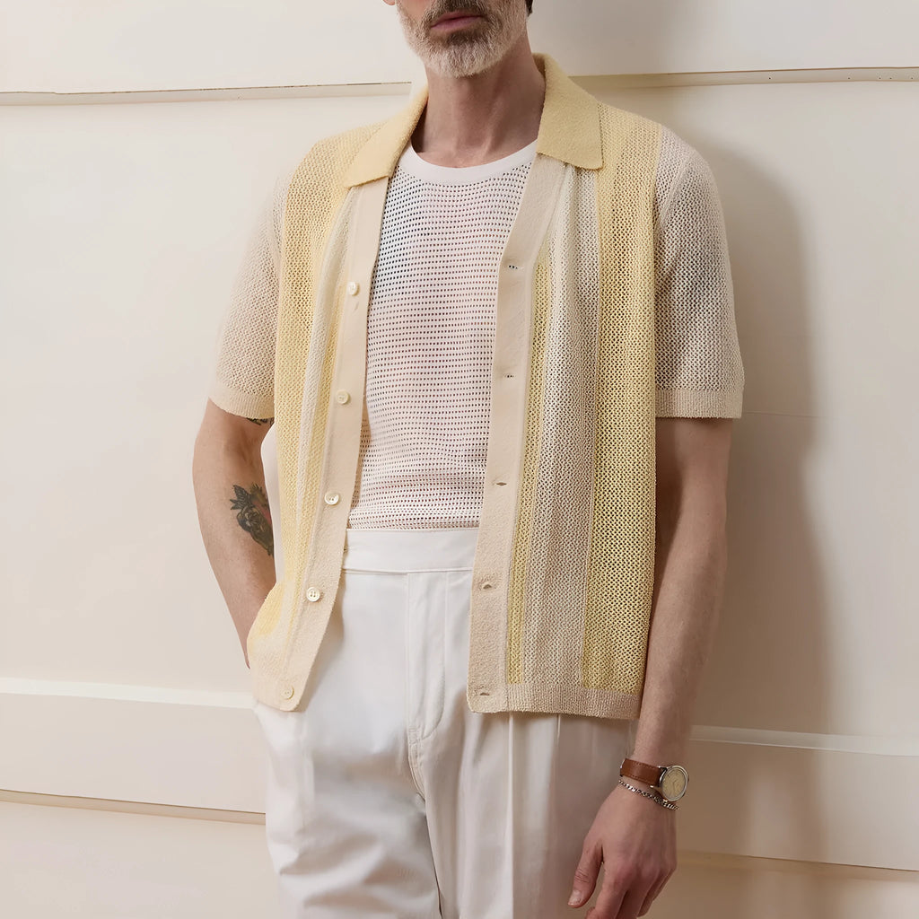 Yellow women's Tencel polo shirt with an asymmetric hemline and hollow-out detail on a short sleeve.