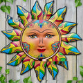 Iron sun face decorative wall hanging with detailed metal patterning in garden theme
