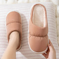 Thick-soled down cotton slippers with artificial leather upper and plush lining in blue green grey pink or yellow