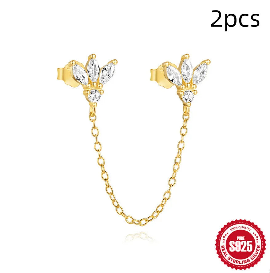 S925 sterling silver geometric stud earrings with inlaid zircon in golden clover, crown, and chain designs.