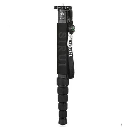 Black carbon fibre monopod for SLR cameras extended to maximum height showing 6 sections