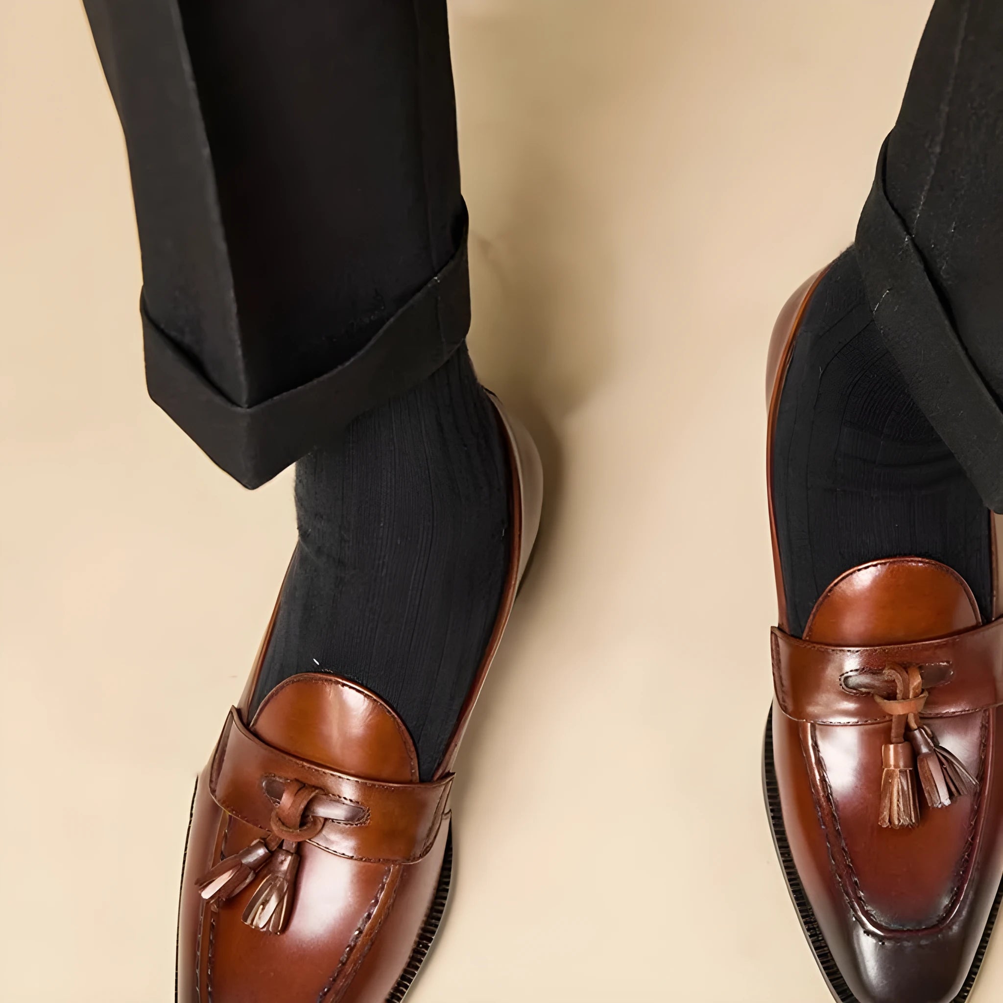 Men's black genuine leather tassel loafers with a rubber sole
