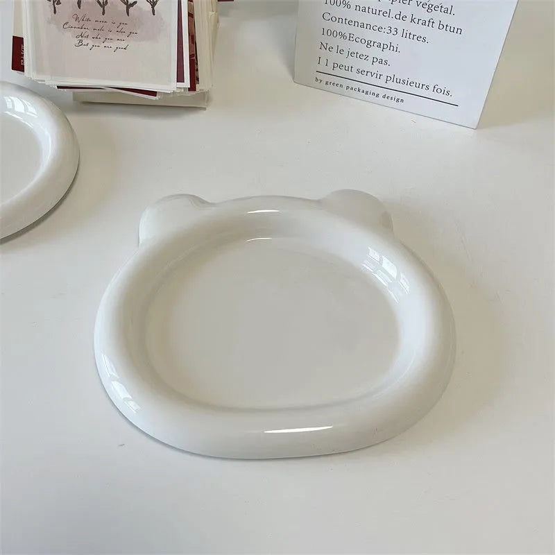 White porcelain chubby toot plate with bear doodle design, suitable for microwave use