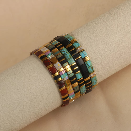 Geometric glass and coloured glaze bead bracelet in milky white, black, green, blue, or red