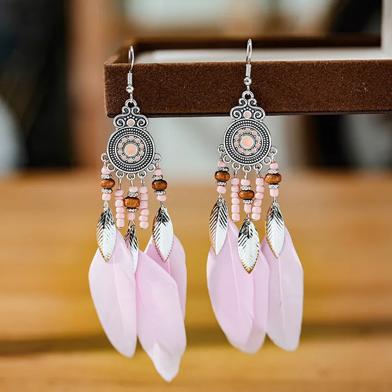 Round drop feather earrings with leaf detailing in various bohemian colours