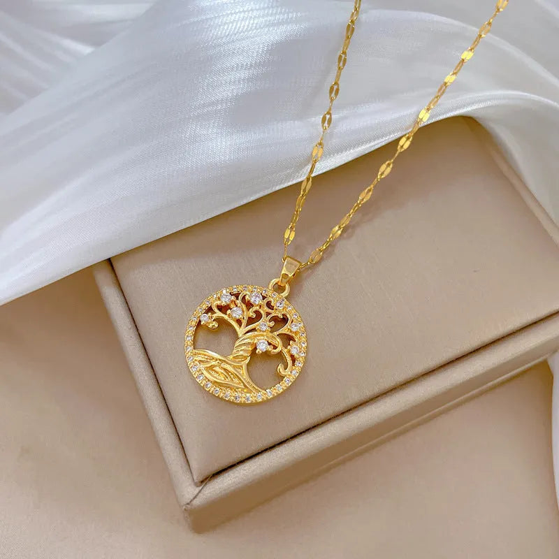 Gold-plated necklace with rhinestone lucky tree pendant and mother of pearl cross on adjustable chain