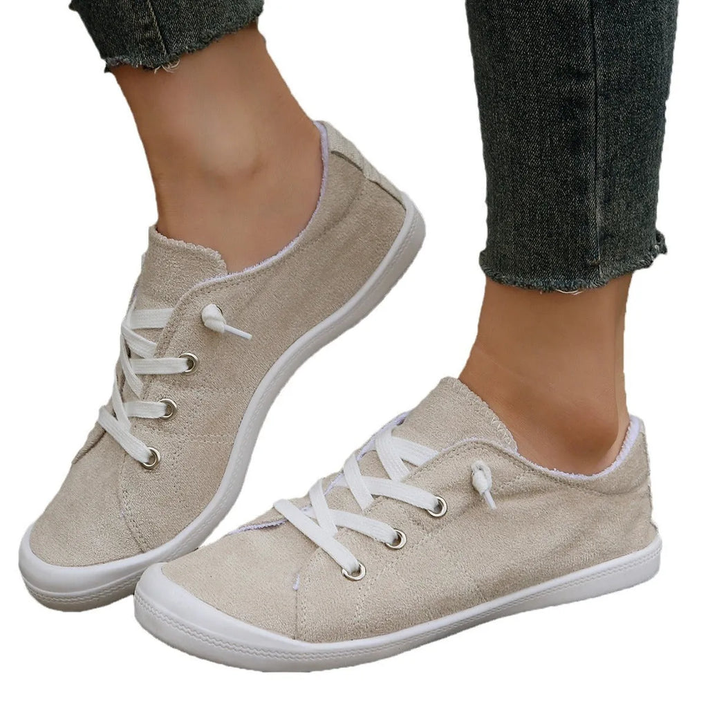 Women's creamy-white fabric low-top casual sneaker with rubber sole