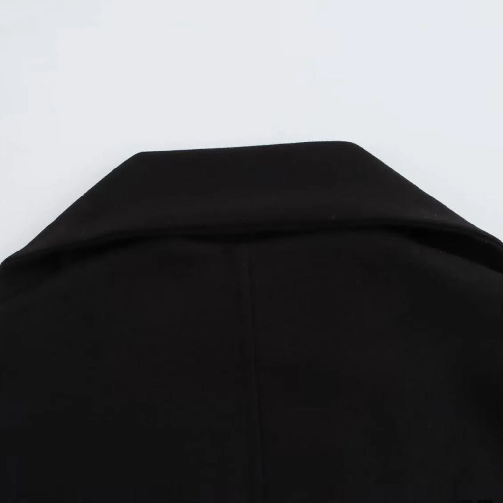 Women's long grey polyester coat with a thick artificial fur collar and pockets.