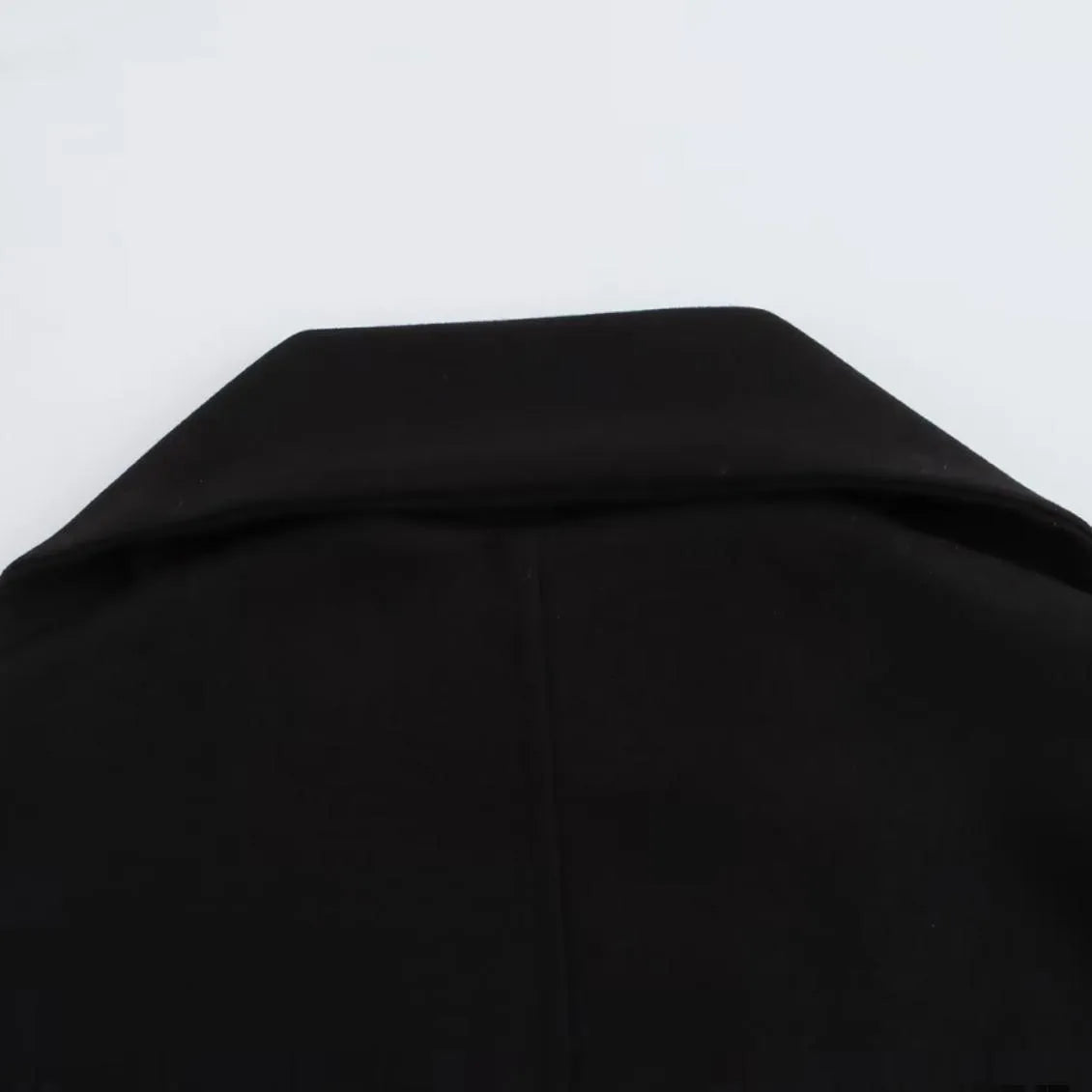 Women's long grey polyester coat with a thick artificial fur collar and pockets.