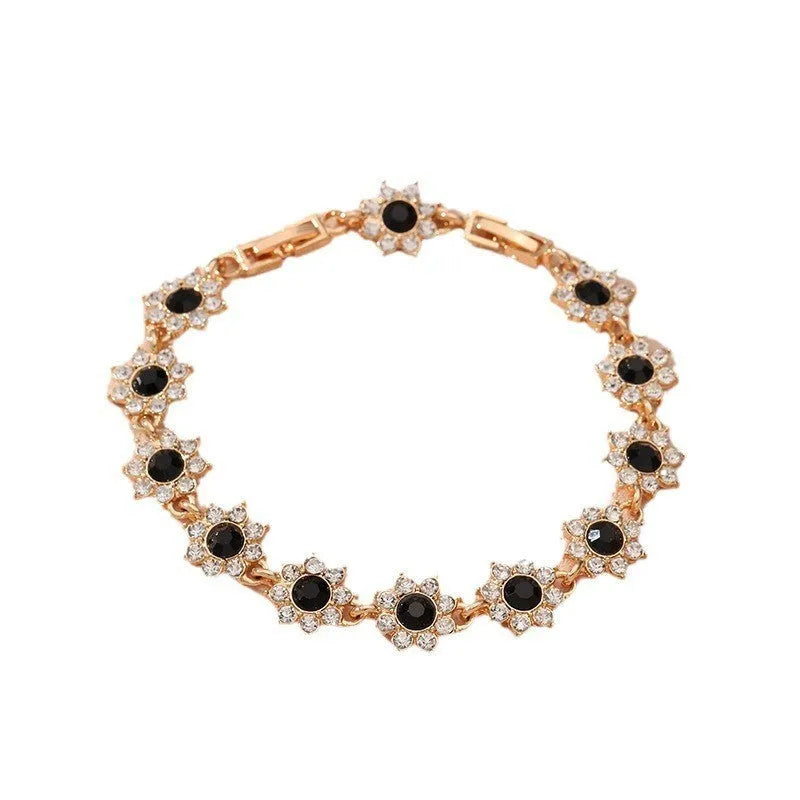 Electroplated zinc alloy bracelet with floral design in gold and silver colour variations