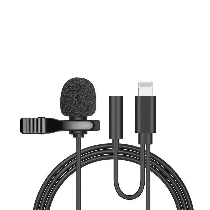 White lavalier lapel clip microphone with long cable and in-ear earpieces next to an iPhone.