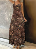 Dark brown leopard print dress with sleeveless sling design and shoulder straps, hip skirt cut
