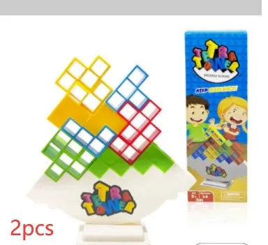 Plastic balance stacking game with 16 coloured building blocks, chassis, and base on a table